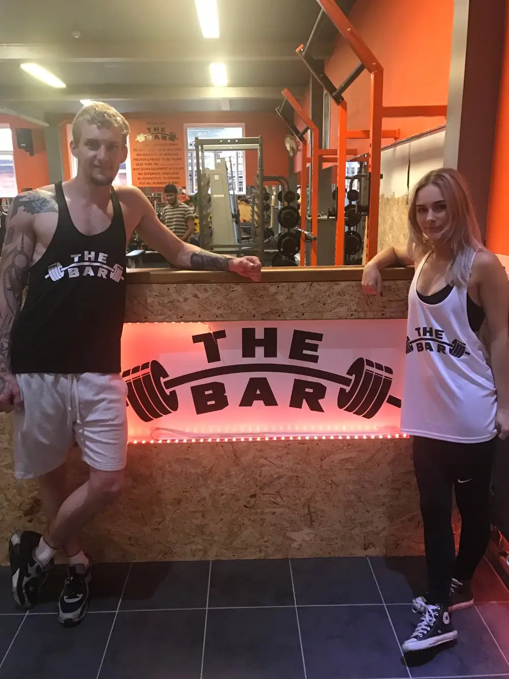 Members at the reception desk with The Bar Gym sign, Worthing, The Bar Gym Worthing