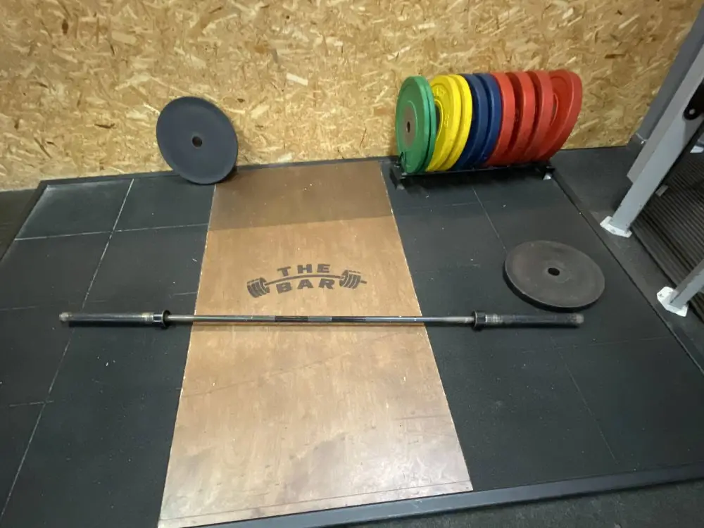 Lifting platform with coloured bumper plates, The Bar Gym Worthing