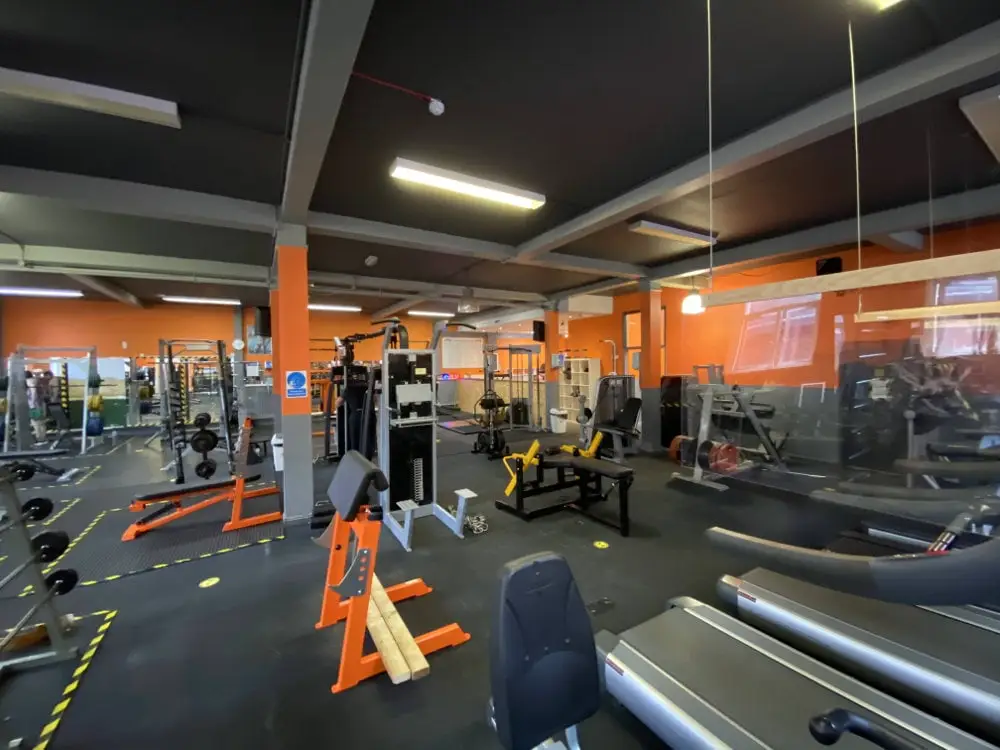 Gym floor with cable machines and racks, The Bar Gym Worthing