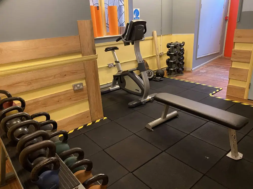 Exercise bike and weights in the cardio corner, The Bar Gym Worthing