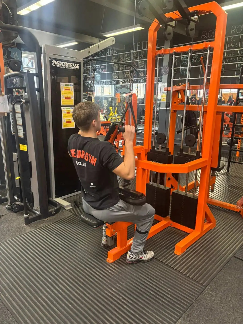 Member using a cable pulldown machine, The Bar Gym Worthing
