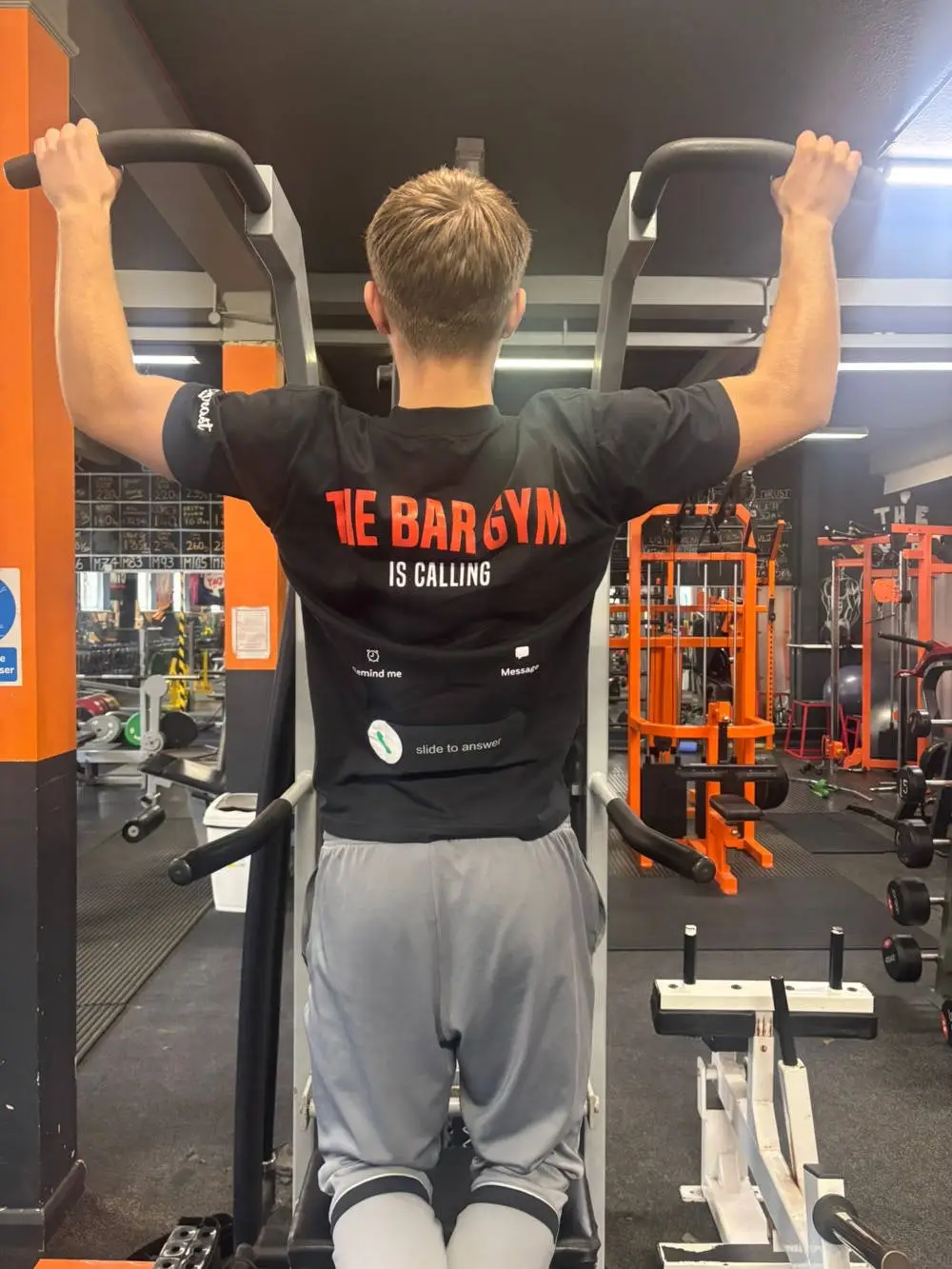 Member doing pull-ups in a Bar Gym shirt, The Bar Gym Worthing