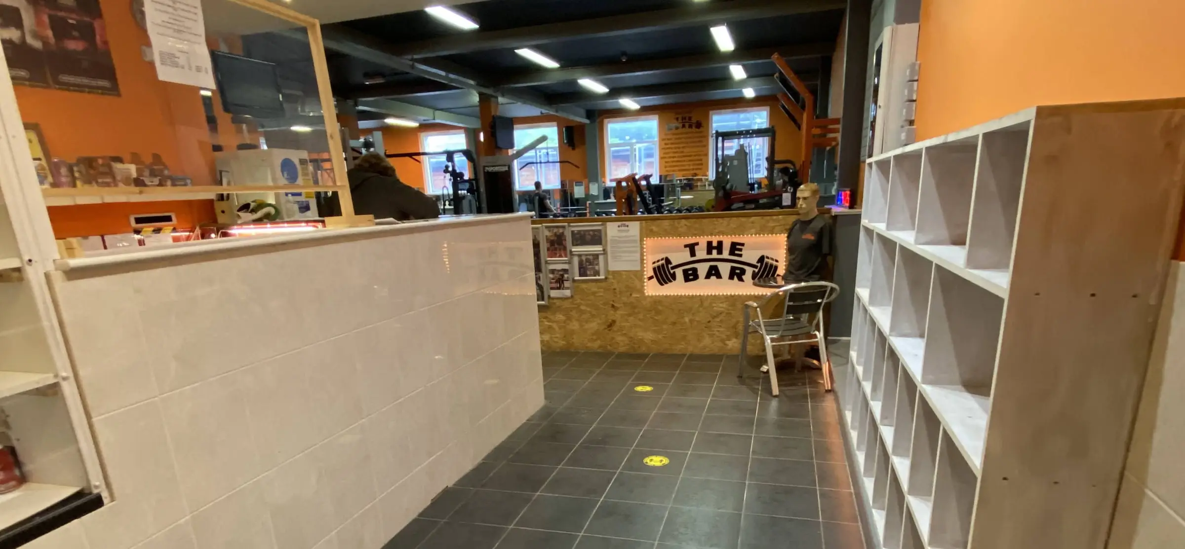 The reception desk with The Bar sign at The Bar Gym Worthing